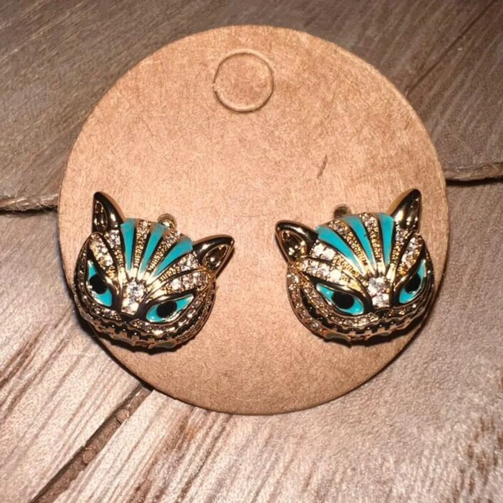 “Cheshire Cat” Alice in Wonderland Toothy Grin Green Striped Steel Fantasy Studs